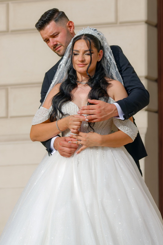 Groom hugging his wife
